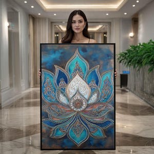 May include: A framed wall art piece featuring a detailed lotus flower design. The artwork showcases a vibrant color palette of blues, turquoise, and copper tones. The lotus is centered on a textured background, creating a striking visual effect.