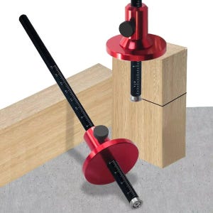 May include: A red and black marking gauge tool with a black ruler and a red circular base. The tool is designed for woodworking and features a measurement scale. The gauge is shown next to a wooden block, highlighting its use for precise marking.