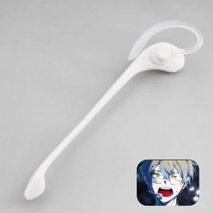 May include: A white wireless earpiece featuring a long, slender boom microphone arm and a clear, curved ear hook. In the bottom right corner, there is a small, rectangular graphic depicting an anime character with light hair and glasses.