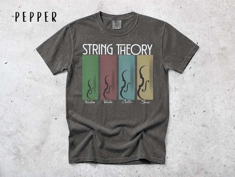 May include: A grey t-shirt with the words "STRING THEORY" in white. Below the text are four vertical rectangles in green, red, blue, and tan, each with a violin illustration and the names "Violin", "Viola", "Cello", and "Bass".