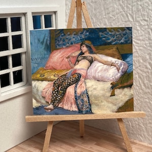 May include: A painting of a woman reclining on a bed, wearing a patterned dress and a jeweled headpiece. The bed is covered in a white fur and has a pink pillow. The background is a blue and white patterned wall.