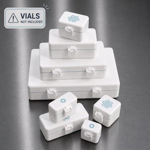 May include: A collection of white rectangular storage boxes in various sizes, featuring hinged lids with secure latches. Some lids display a light blue hexagonal pattern. A sign in the upper left corner states: VIALS NOT INCLUDED.
