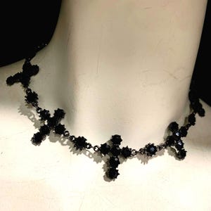 Black crystal cross choker necklace.