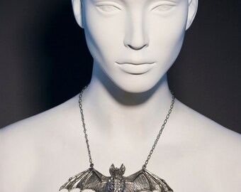 Bat Pendant Necklace Made With Clear Crystals and Antique Silver Plated. Hypoallergenic and has an adjustable chain.