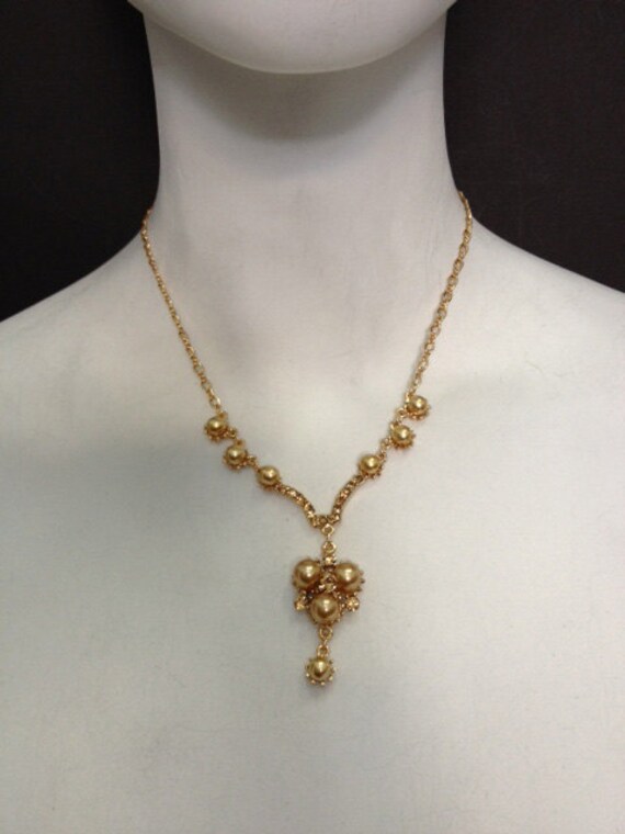 Items similar to Cluster drop necklace made with gold pearls and light ...