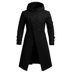 May include: A long black hooded coat with a unique asymmetrical design. The coat features a zipper closure, multiple pockets, and adjustable straps with buckles. The coat has a long length, reaching below the knees.