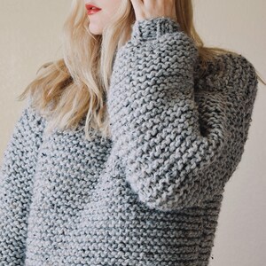 Front view of chunky knit turtleneck sweater in bulky yarn, cozy oversized pullover knitting pattern