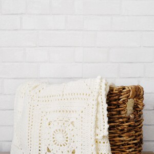 Granny square crochet pattern blanket folded display, handmade textile home accent granny square blanket crochet pattern. crochet modern throw blanket. hygge decor modern crochet throw afghan decor blanket. granny square lace crochet throw baby blanket.