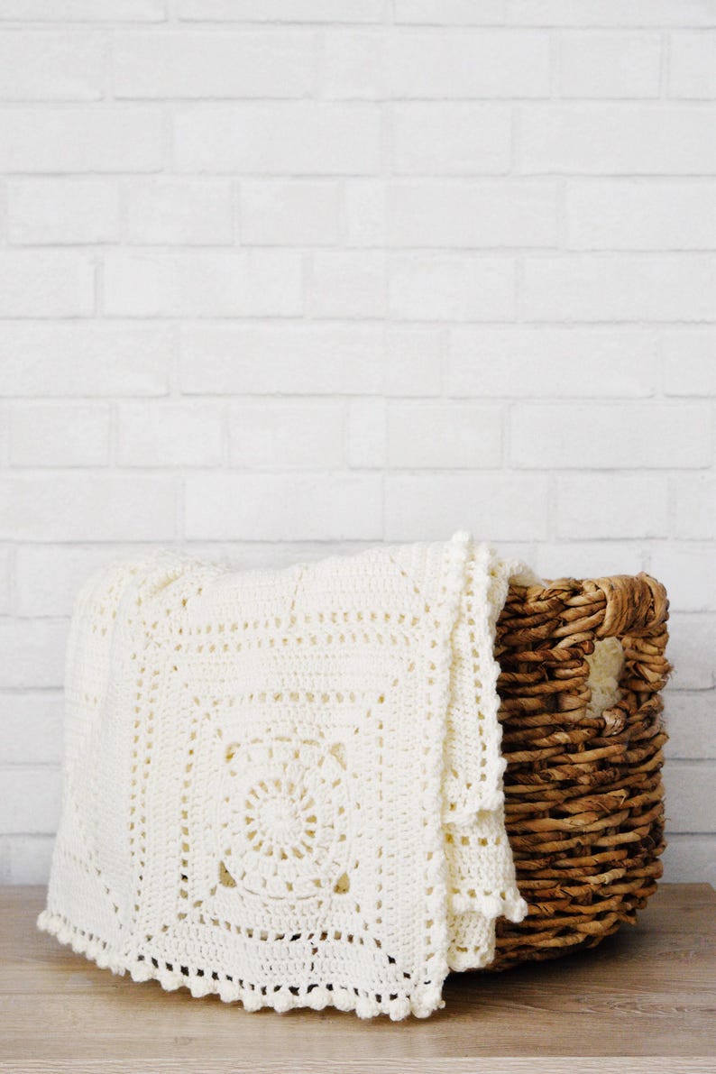 Granny square crochet pattern blanket folded display, handmade textile home accent granny square blanket crochet pattern. crochet modern throw blanket. hygge decor modern crochet throw afghan decor blanket. granny square lace crochet throw baby blanket.