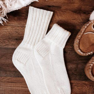 basic socks knitting pattern. fold over socks knit pattern. easy knit women socks. top down knit socks pattern. cream white knit socks pattern. beginner socks knitting pattern. adult women knit socks pattern. classic knti socks.