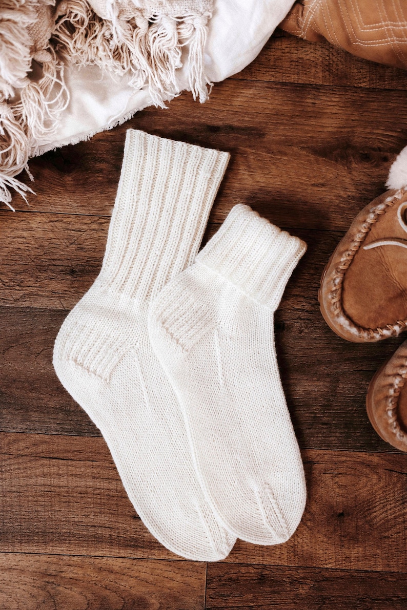 basic socks knitting pattern. fold over socks knit pattern. easy knit women socks. top down knit socks pattern. cream white knit socks pattern. beginner socks knitting pattern. adult women knit socks pattern. classic knti socks.