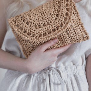 Raffia clutch crochet pattern, straw bag crochet pattern. crochet straw purse pattern. crochet raffia purse tote pattern. easy crochet purse. crochet tote handbag. straw summer bag crochet pattern. beginner crochet bag pattern.  Sunrise Clutch Crochet Pattern, Raffia Clutch Bag Crochet Pattern, Straw Summer Bag Crochet Pattern, Bag Crochet Pattern, Raffia Clutch Crochet Pattern, Summer Bag Crochet Pattern, Easy Crochet Patterns, Beginner Crochet Pattern, Tote Crochet Pattern