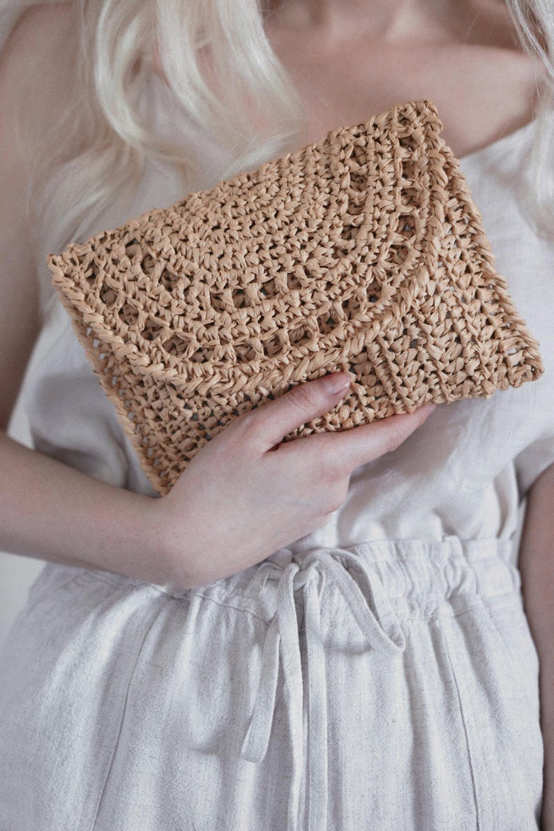 Raffia clutch crochet pattern, straw bag crochet pattern. crochet straw purse pattern. crochet raffia purse tote pattern. easy crochet purse. crochet tote handbag. straw summer bag crochet pattern. beginner crochet bag pattern.  Sunrise Clutch Crochet Pattern, Raffia Clutch Bag Crochet Pattern, Straw Summer Bag Crochet Pattern, Bag Crochet Pattern, Raffia Clutch Crochet Pattern, Summer Bag Crochet Pattern, Easy Crochet Patterns, Beginner Crochet Pattern, Tote Crochet Pattern