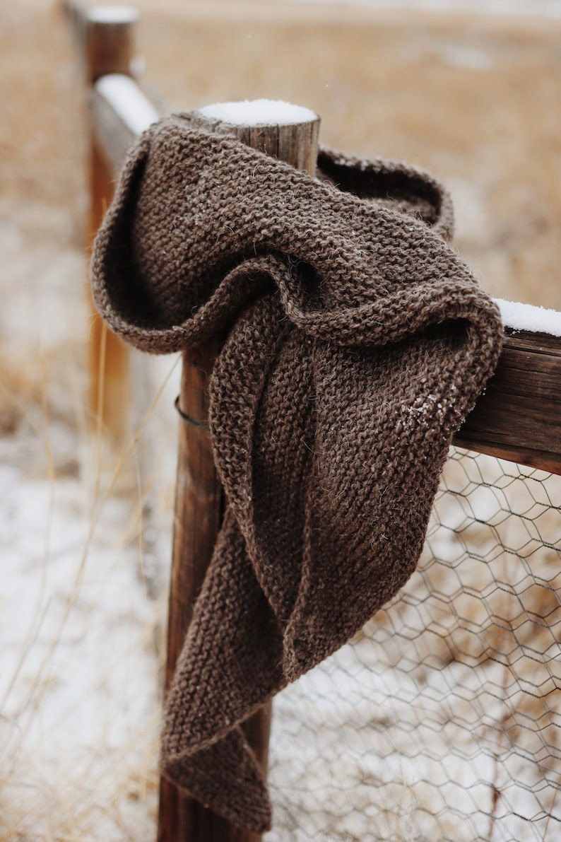 Beginner scarf knitting pattern, easy classic women's knit scarf in worsted weight yarn. Boomerang knit scarf pattern. simple beginner knit wrap PDF instant download. Beginner scarf shawl knitting pattern by Darling Jadore. it's a boomerang asymmetrical shawl knitting pattern designed for beginners. Brown scarf knitting pattern garter stitich easy knitting pattern by Darling Jadore