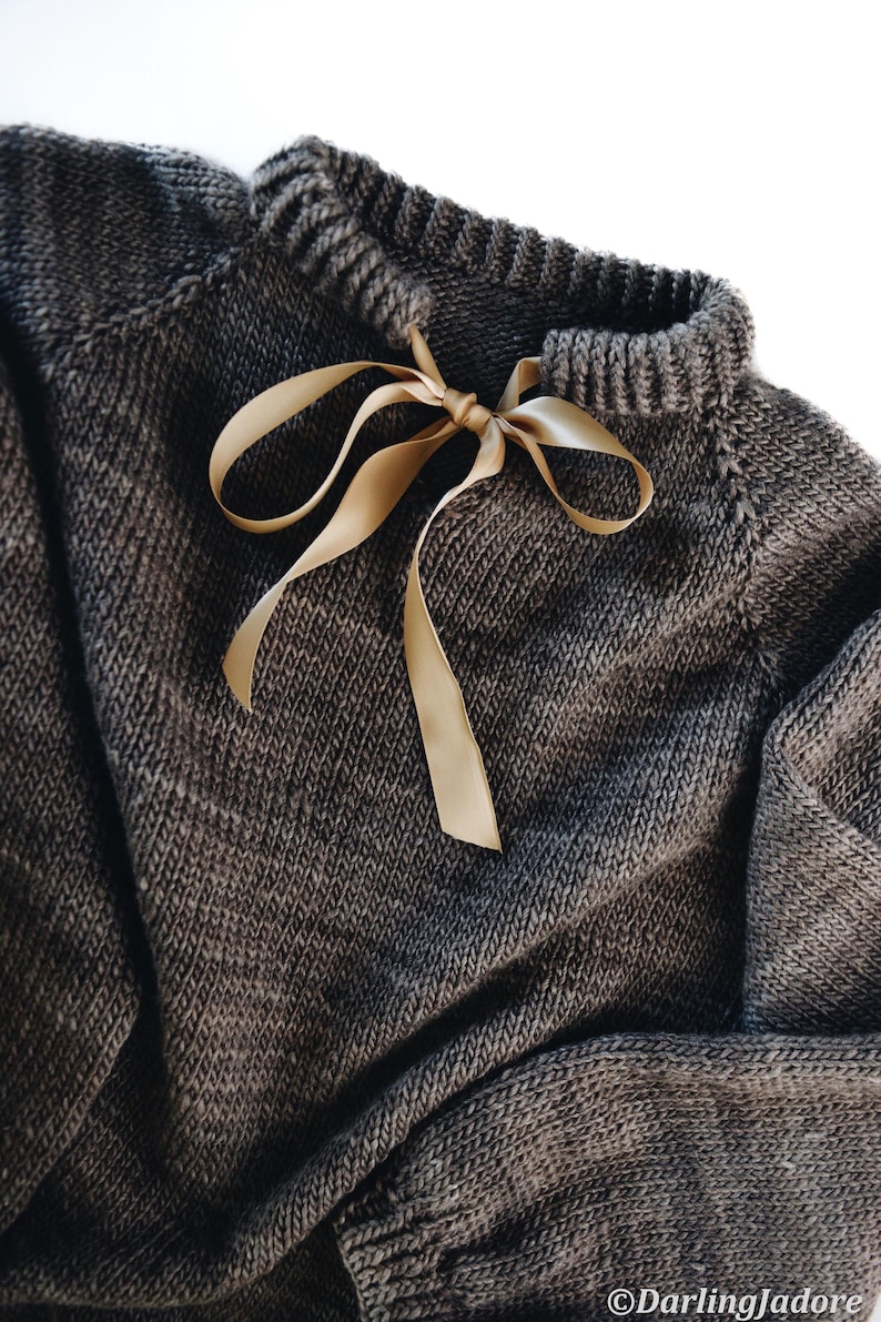 Close-up of seamless raglan construction on oversized beginner pullover, top-down knitting pattern Beginner sweater knitting pattern, oversized top-down raglan pullover in worsted weight yarn, women's seamless crewneck knit jumper. ribbon tie knit sweater pattern. oversize raglan jumper pattern for women
