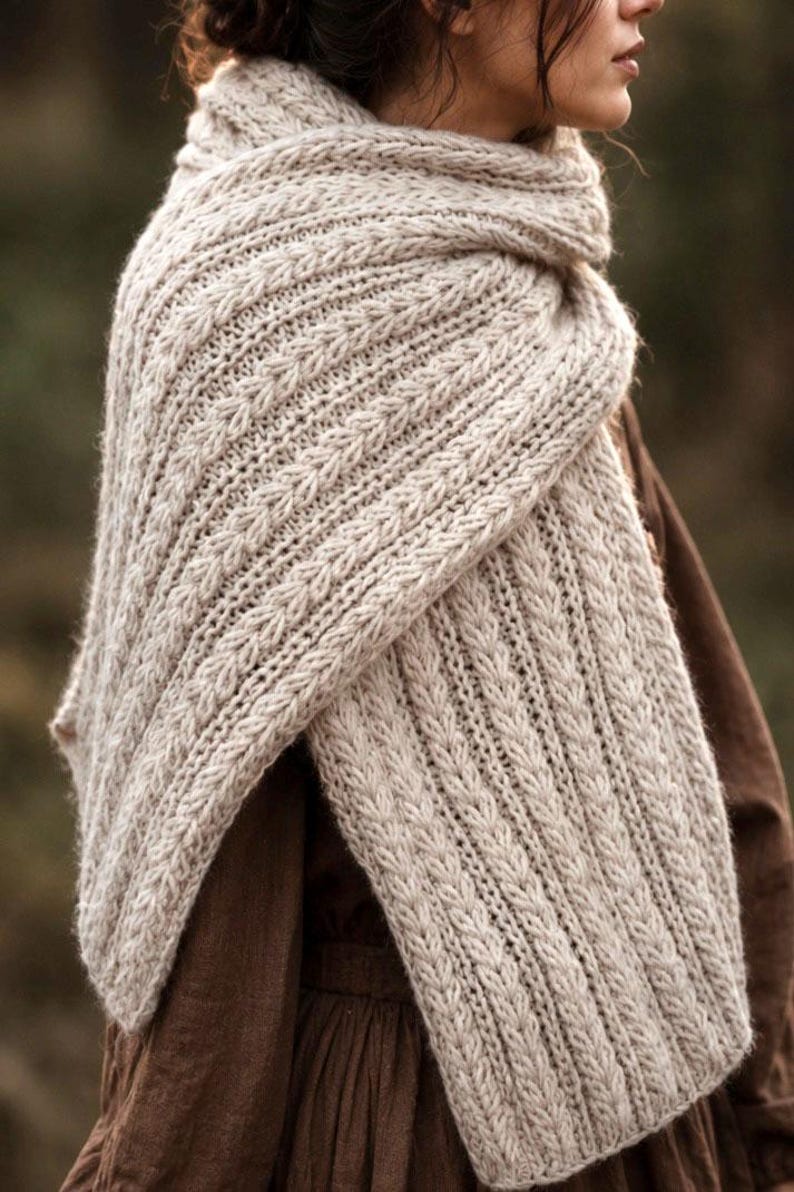 Knitting pattern scarf folded on neutral background, cozy chunky knit accessory display. easy scarf knitting pattern, chunky knit scarf pattern. Warm wrap scarf knitting pattern, oversized women's knit scarf in worsted weight yarn, easy beginner cozy knit wrap PDF instant download. women knit scarf pattern, easy knitting pattern. rectangle scarf knit pattern. chunky heart scarf knit pattern