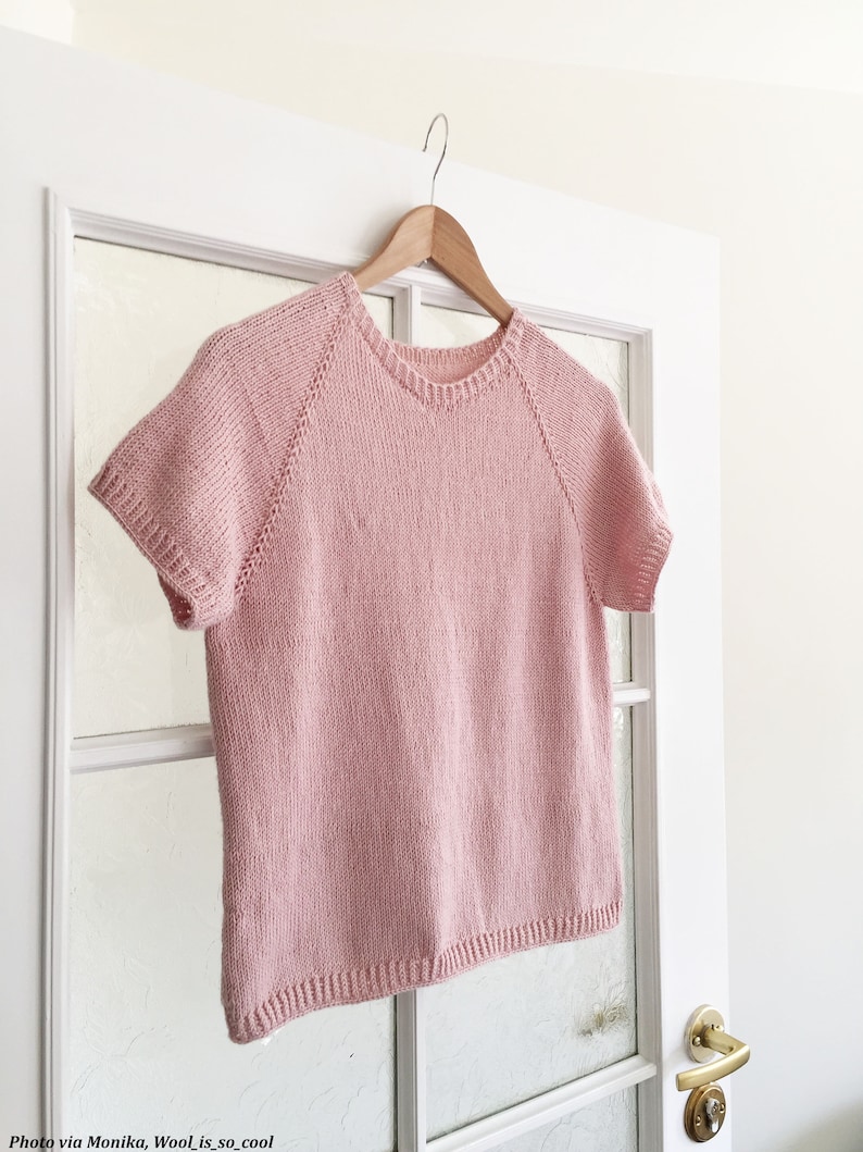 A knitted tshirt, The Classic Tee, is hanging on a door and knit using pink yarn. This basic knit shirt features a raglan construction and pretty knit stitches. This knit tee looks lightweight and comfortable for summer.
[easy knitting patterns]