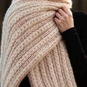 Knitting pattern scarf folded on neutral background, cozy chunky knit accessory display. easy scarf knitting pattern, chunky knit scarf pattern. Warm wrap scarf knitting pattern, oversized women's knit scarf in worsted weight yarn, easy beginner cozy knit wrap PDF instant download. women knit scarf pattern, easy knitting pattern. rectangle scarf knit pattern. chunky heart scarf knit pattern