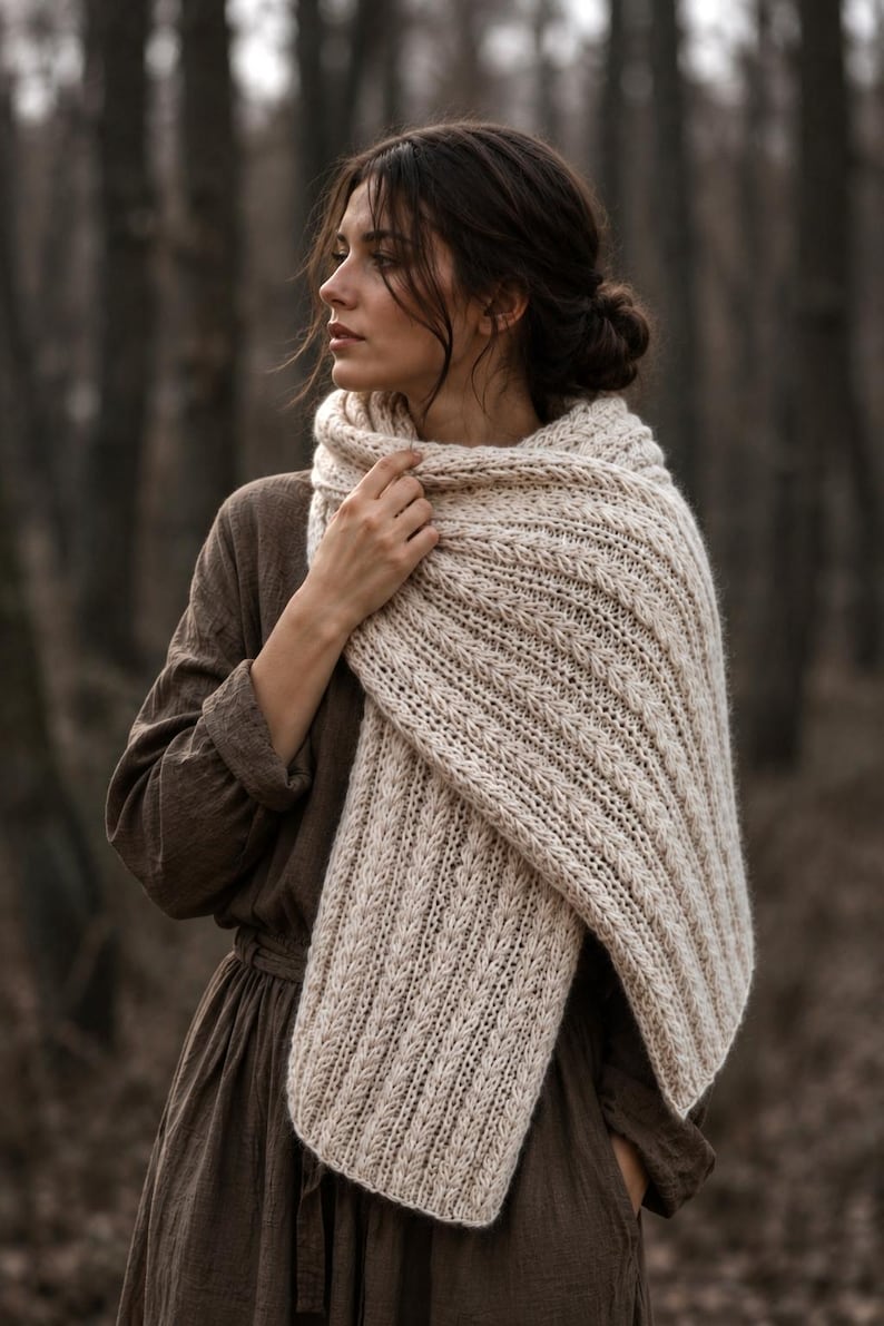 Knitting pattern scarf folded on neutral background, cozy chunky knit accessory display. easy scarf knitting pattern, chunky knit scarf pattern. Warm wrap scarf knitting pattern, oversized women's knit scarf in worsted weight yarn, easy beginner cozy knit wrap PDF instant download. women knit scarf pattern, easy knitting pattern. rectangle scarf knit pattern. chunky heart scarf knit pattern
