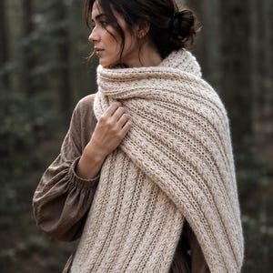 Knitting pattern scarf folded on neutral background, cozy chunky knit accessory display. easy scarf knitting pattern, chunky knit scarf pattern. Warm wrap scarf knitting pattern, oversized women's knit scarf in worsted weight yarn, easy beginner cozy knit wrap PDF instant download. women knit scarf pattern, easy knitting pattern. rectangle scarf knit pattern. chunky heart scarf knit pattern