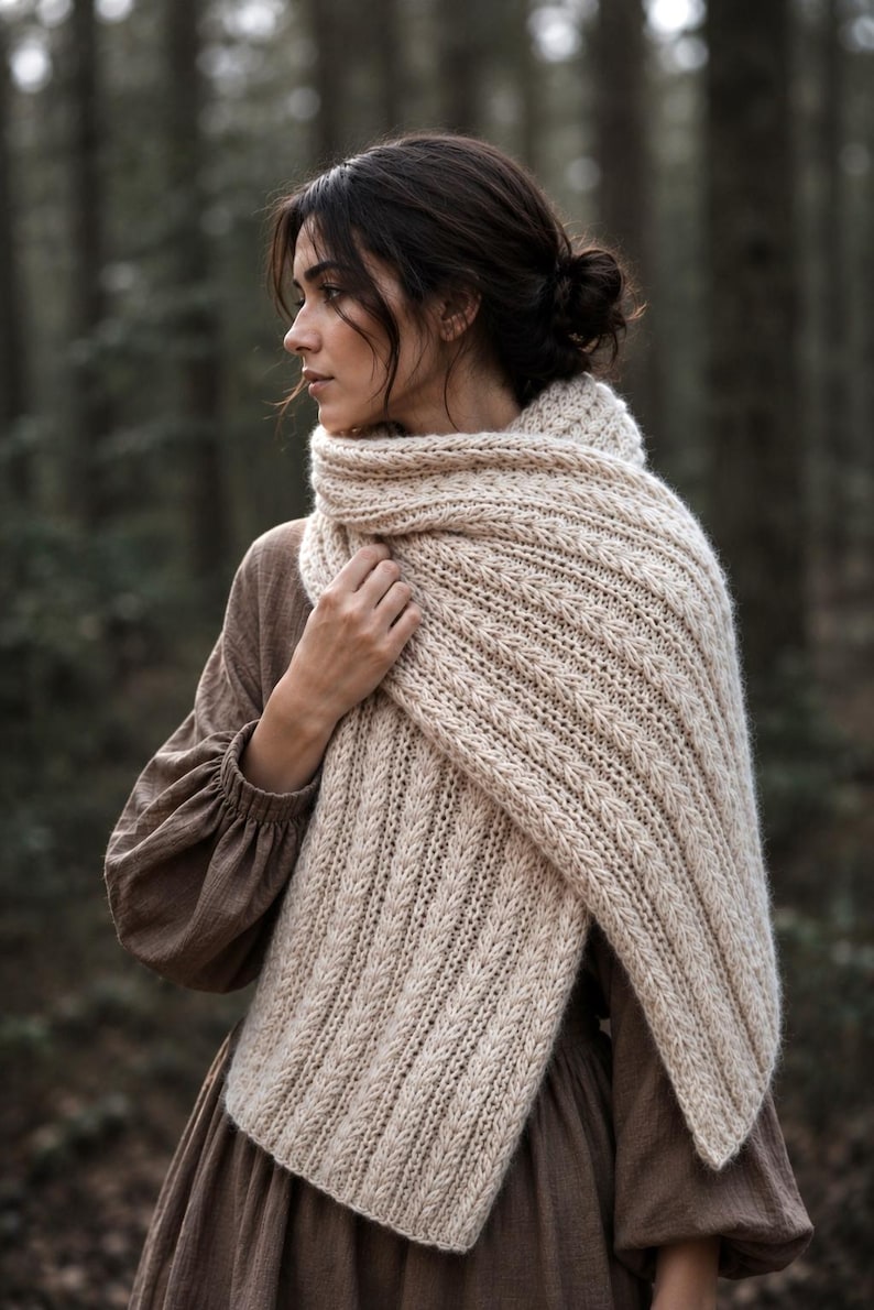 Knitting pattern scarf folded on neutral background, cozy chunky knit accessory display. easy scarf knitting pattern, chunky knit scarf pattern. Warm wrap scarf knitting pattern, oversized women's knit scarf in worsted weight yarn, easy beginner cozy knit wrap PDF instant download. women knit scarf pattern, easy knitting pattern. rectangle scarf knit pattern. chunky heart scarf knit pattern