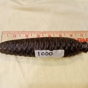 One (1) Antique Cuckoo Clock Weight Cast Iron 1000 grams 7.25 inches long Pinecone weight for certain antique Cuckoos, as-is parts only