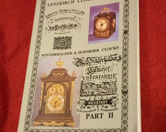 Puede incluir: Una portada de folleto gris claro titulada PART I LENZKIRCH CLOCK FACTORY y PART II WINTERHALDER & HOFMEIER CLOCKS. Incluye logotipos y textos históricos en blanco y negro, junto con dos fotografías en color de relojes antiguos.