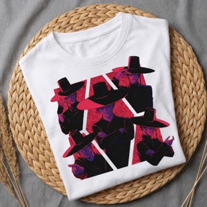 May include: White t-shirt featuring a graphic design of five figures wearing black hats and clothing, set against a red and white geometric background. The figures have purple skin and are in various poses.