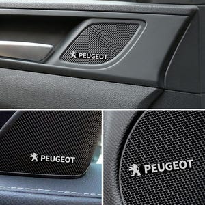 Dekorativa klistermärken för Peugeots billogotyp och ljudsystem