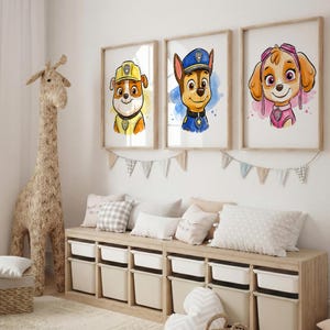 May include: Three framed watercolor prints of cartoon dogs from Paw Patrol. Each dog is wearing a uniform and has a unique expression. The prints are displayed above a storage bench with white bins. A large giraffe sculpture stands to the left.