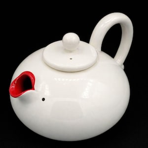 May include: A set of three ceramic mugs with a speckled, matte finish. The mugs are in shades of cream, light gray, and dark gray. Each mug has a simple, minimalist design, perfect for coffee or tea.