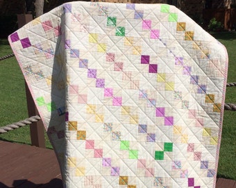 Pastels And The Scrappy Look Of Vintage Modern In This 39" X 47.5" Postage Stamp Quilt