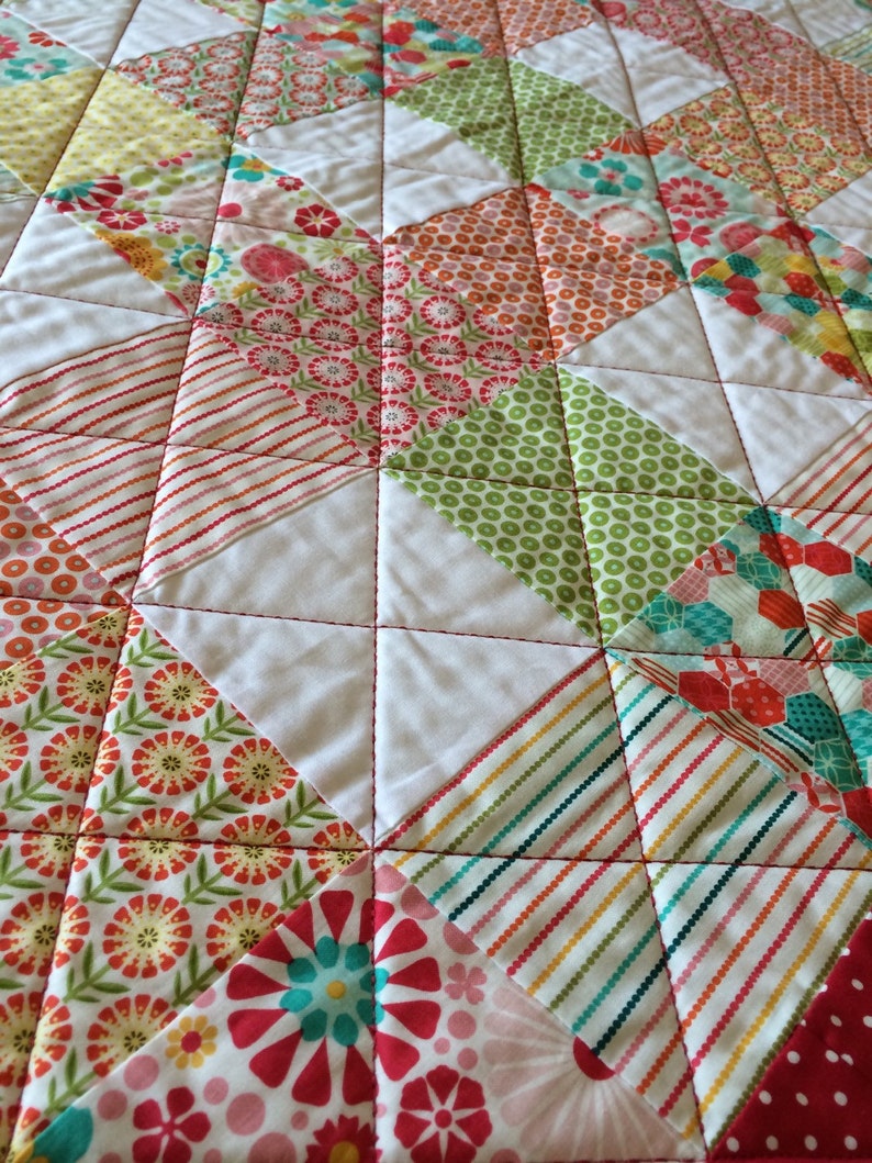 Pink Yellow and More Are All Together In This 40.5 X 49.5 Quilt In The Line Called So Happy By Deena Rutter For Riley Blake Red Aqua