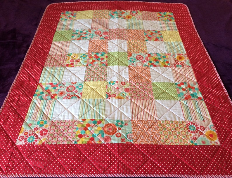 Pink Yellow and More Are All Together In This 40.5 X 49.5 Quilt In The Line Called So Happy By Deena Rutter For Riley Blake Red Aqua