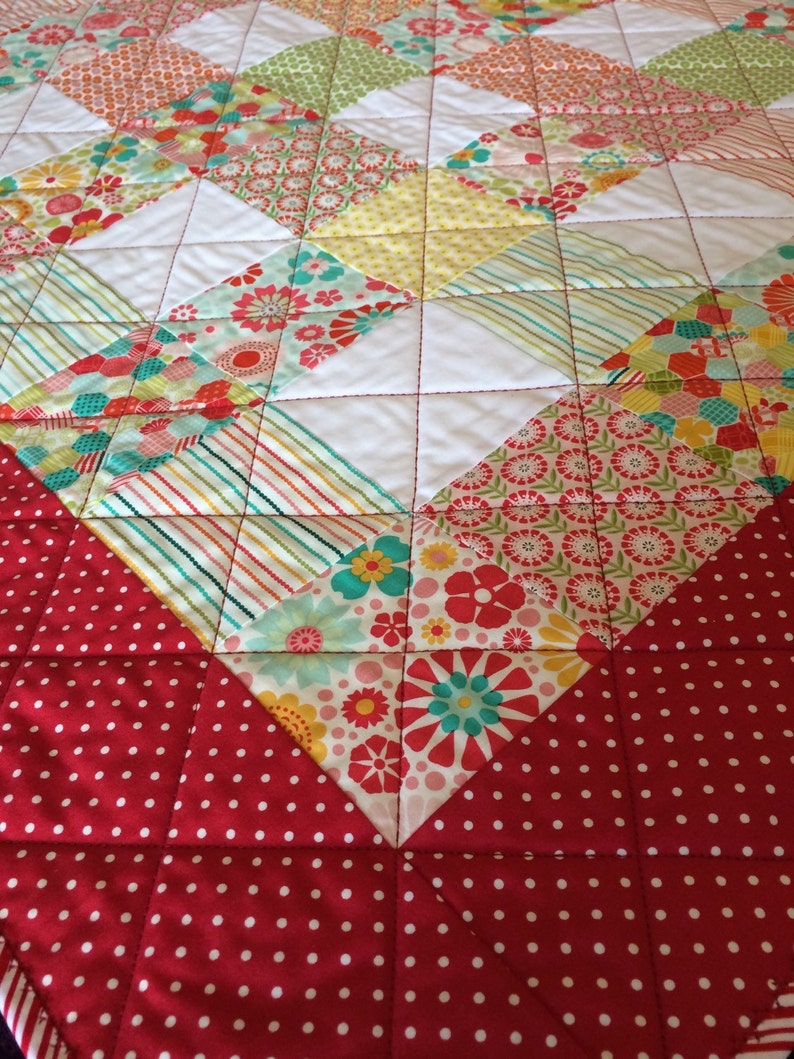 Pink Yellow and More Are All Together In This 40.5 X 49.5 Quilt In The Line Called So Happy By Deena Rutter For Riley Blake Red Aqua