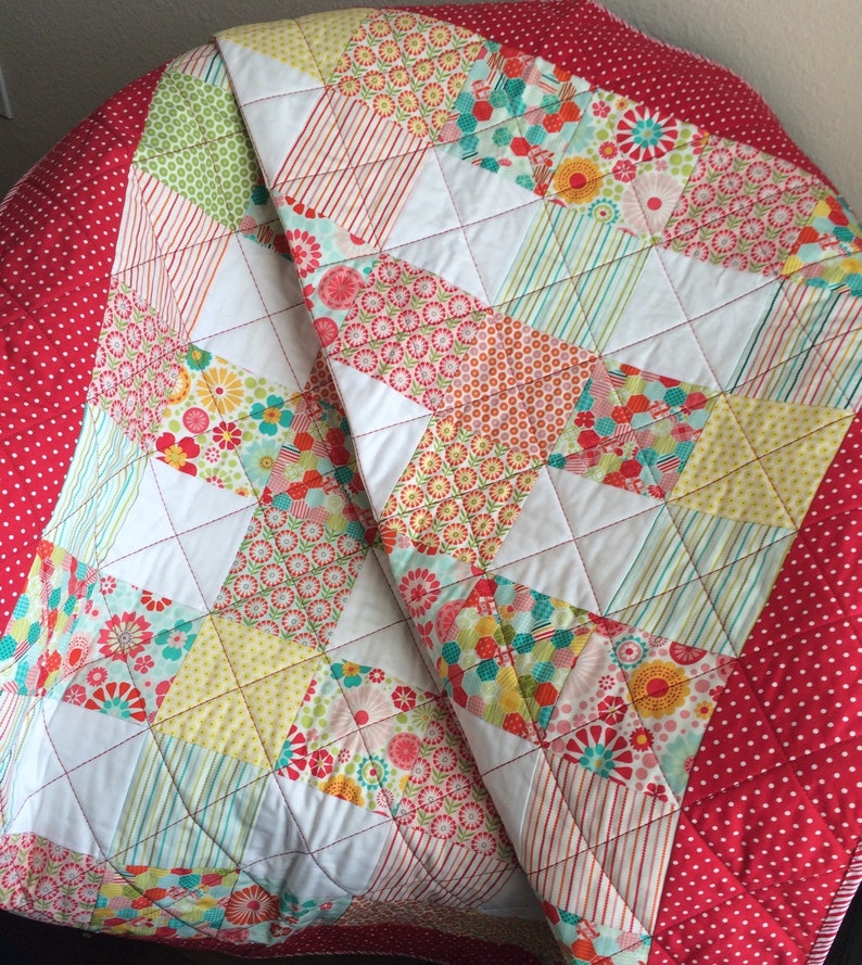 Pink Yellow and More Are All Together In This 40.5 X 49.5 Quilt In The Line Called So Happy By Deena Rutter For Riley Blake Red Aqua