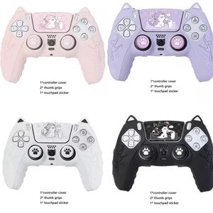 May include: Four video game controller silicone covers in pink, purple, white, and black, each featuring cat ear accents, paw print thumb grips, and a touchpad sticker with a cartoon cat illustration. Text below each reads 1*controller cover, 2*thumb grips, 1*touchpad sticker.