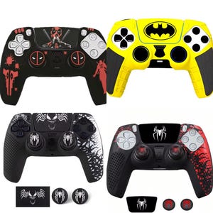 May include: Four game controllers with unique designs. One is black with red accents and a Deadpool graphic. Another is yellow with a Batman logo. The other two are black with Spider-Man and Venom themes. Includes extra button covers.