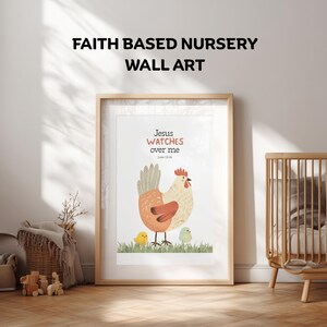 May include: Framed wall art with a light wood frame. The artwork features a cartoon chicken with two chicks on green grass. Text at the top says "Faith Based Nursery Wall Art." The artwork also includes the text "Jesus watches over me" and the Bible verse Luke 12:34.