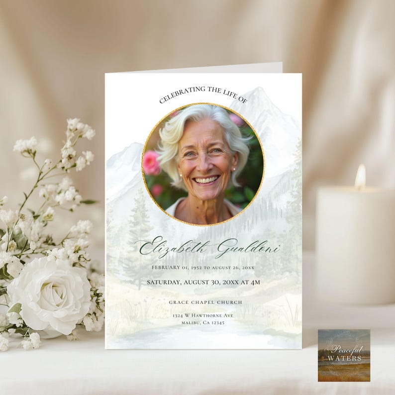 May include: A memorial card with a photo of a smiling woman in a gold-rimmed circle, with the text "Celebrating the Life of Elizabeth Gualdoni." The card includes dates, time, and the Grace Chapel Church address. The background features a watercolor mountain and forest scene.
