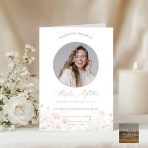 May include: A memorial card with a photo of a smiling woman in a circular frame. The text reads "Celebrating the Life of Alisha Miller" with dates and service details. Soft floral accents and a candle are in the background.