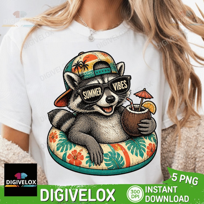 May include: White t-shirt featuring a cartoon raccoon wearing sunglasses with the text "SUMMER VIBES". The raccoon is in a floral inner tube and holding a coconut drink. The design includes a hat with a sunset and palm trees.
