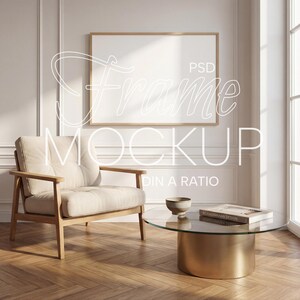 May include: A living room scene featuring a framed artwork mockup. The room includes a beige armchair, a coffee table with a glass top and gold base, and a decorative bowl. The text "Frame Mockup" is visible on the image.