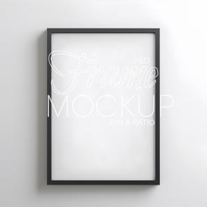 May include: A black rectangular frame mockup with white text that reads "Frame Mockup PSD DIN A RATIO" on a white background. The frame is empty, ready for artwork or a print.