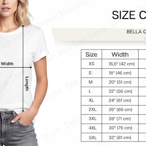 以下が含まれることがあります： 白のユニセックスTシャツとサイズチャート。チャートにはXSから5XLまでのサイズが記載されており、幅と長さの測定値はcmです。シャツはBella Canvas 3001です。