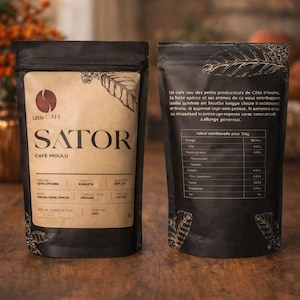 May include: Two black coffee bags with the text "Little Cafe Sator" and nutritional information. The bags have a brown paper label with coffee bean illustrations. The coffee is from Côte d'Ivoire.