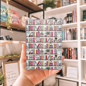 May include: A clear phone case featuring a colorful bookshelf pattern with books, plants, and the text "GOOD GIRL". The design includes various book spines, cakes, and coffee cups on a light green background.