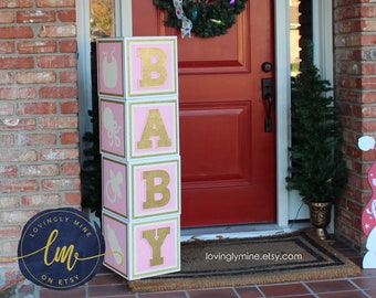 white and gold baby blocks