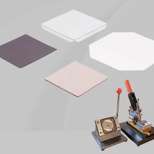 May include: A button making machine with a red handle and a metal base, accompanied by four flat shapes: a dark gray square, a white square, a light pink square, and a white octagon. The equipment is designed for crafting custom buttons.