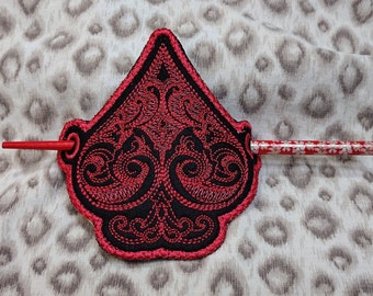 Red Ace of Spades embroidered hair bun cover with hair stick.